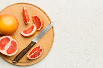 fresh Fruit grapefruit slices on colored background. Top view. Copy Space. creative summer concept. Half of citrus in minimal flat lay with copy space