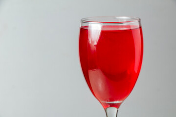 red syrup wine glass negative space glass body with gray isolated