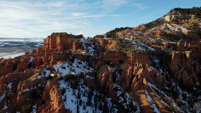 Aerial shot of the rugged and snow covered landscape of southern Utah in winter.