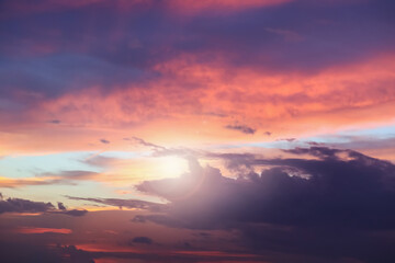 Fototapeta premium Dramatic atmosphere panorama view of fantasy twilight sky and clouds with bright shiny golden sunlight.