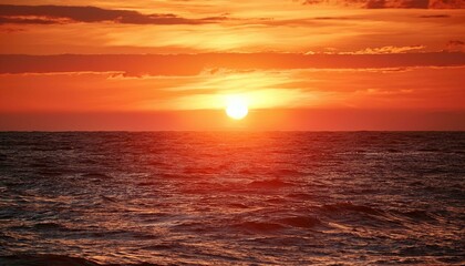 A serene sunset over the ocean with vibrant colors reflecting on the waves and sky
