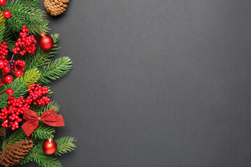 Fir tree branches with Christmas decor on grey background, flat lay. Space for text