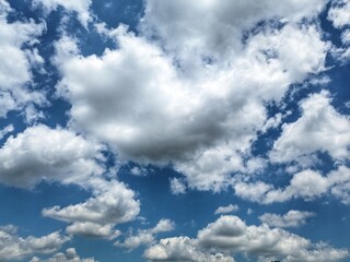 Fototapeta premium A photo of a blue sky with a unique cloud blob. Photographed in the morning. 