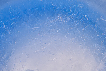 Texture of winter ice surface. Blue natural ice background