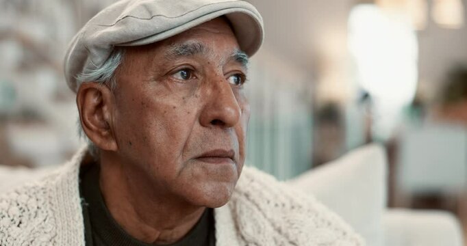 Thinking, home and elderly man on sofa for depression, nostalgia and reflection in living room. Sadness, retirement and face of person with thoughtful, memory and wondering expression for dementia