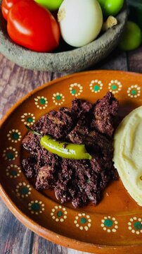 Dish full of moronga or blood sausage, with tortillas, a typical food from Mexico, Central America and Latin America made with rice, spices and pig's blood.