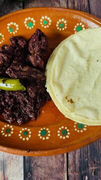 Dish full of moronga or blood sausage, with tortillas, a typical food from Mexico, Central America and Latin America made with rice, spices and pig's blood.