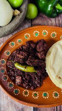 Dish full of moronga or blood sausage, with tortillas, a typical food from Mexico, Central America and Latin America made with rice, spices and pig's blood.