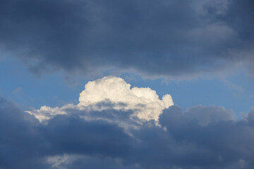 
sky with pale white cloud among dark clouds