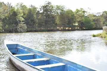 Obraz premium Small Lake and Boat floating