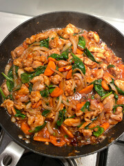 Stir-fried of chicken and vegetables in the pan.