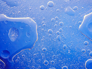 Bubbles on blue background. Abstract oxygen bubble water in sea sponge on blue background.Blue...