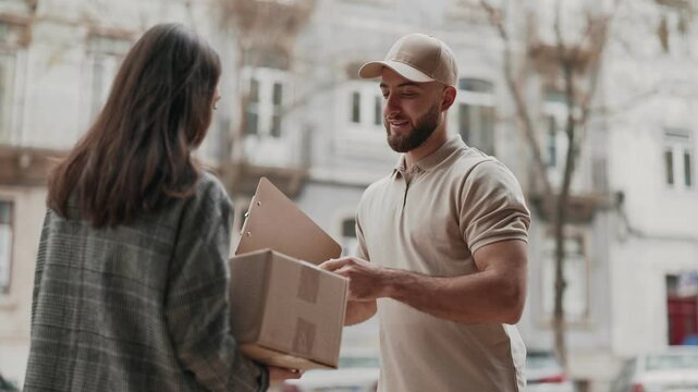 A client gets a delivery at her doorsteps, accepting a package from the courier, depicting the convenience and personal interaction in modern delivery services.