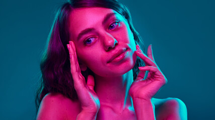 Framed by glowing hands, this portrait underscores healthy skin and vibrant beauty, ideal for...