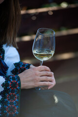 person holding glass of wine