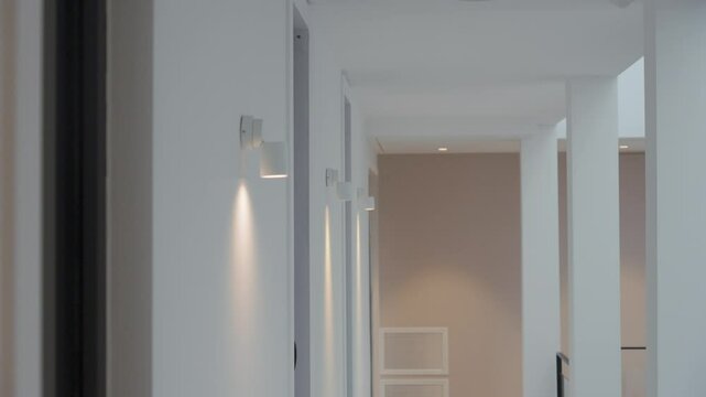 Slow motion shot of interior lights being switched on within a villa