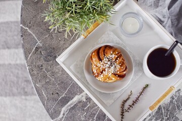 Swedish cinnamon bun with coffee. Swedish fika.top view.