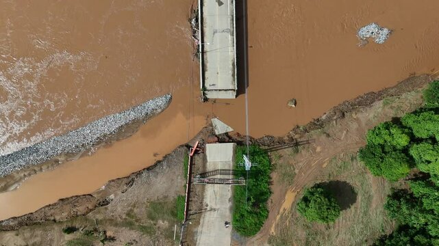 Aerial view of a broken bridge in Doi Hang subdistrict after Typhoon Yagi has swept Chiang Rai province of Thailand.