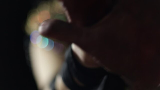 Female hands dancing, light and shadow, out of focus and shine
