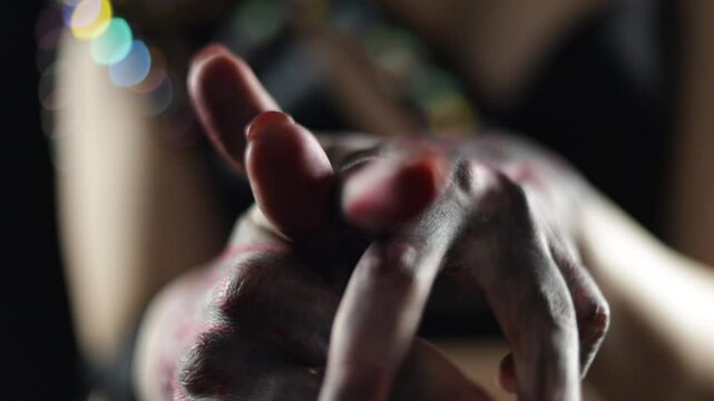 Female hands dancing, light and shadow, out of focus and shine