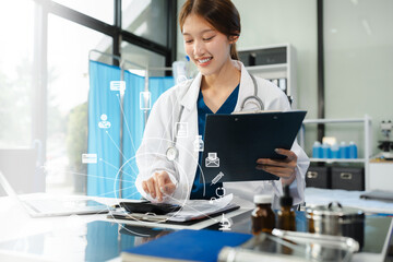 Healthcare costs and fees concept.Hand of smart doctor used a calculator for medical costs in...