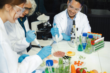 Microbiologist Working on Molecule Samples in Modern Food Science Laboratory, Control experts...