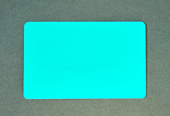 a blank green card on a textured gray background, perfect for mockups, design projects, or creative presentations