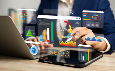 Analyst utilizing technology and dashboard with charts data science and Big Data technology for...