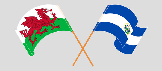 Crossed and waving flags of Wales and Republic of El Salvador. Vector illustration