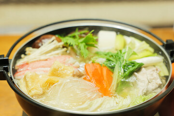 Traditional Japanese one-pot dish, consisting of carrots and other vegetables, mushrooms, meat, fish or crab, etc., simmered in a pot.