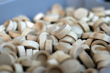 Several small wooden lids stacked