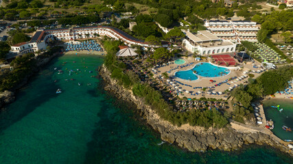 Aerial view of a hotel with sea view. It also has a small private beach and swimming pool.