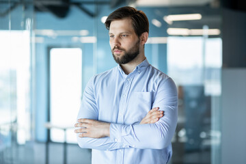 Confident Businessman Standing in Modern Office Environment