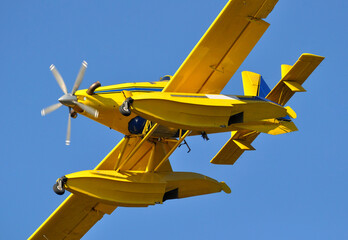View from below of a seaplane flying in the sky or aviation for firefighting, sos, protection and security