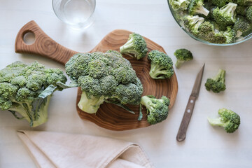 Fresh broccoli on a wooden cutting board