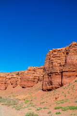 Fototapeta premium Charyn Canyon, Valley of Castles. The excellence of Kazakhstan. Panorama of natural unusual landscape. The red canyon of extraordinary beauty looks like a Martian landscape.