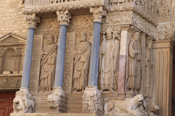 exterior sculptures and columns of old church in Arles France