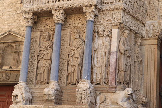 exterior sculptures and columns of old church in Arles France