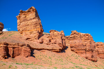 Fototapeta premium Charyn Canyon, Valley of Castles. The excellence of Kazakhstan. Panorama of natural unusual landscape. The red canyon of extraordinary beauty looks like a Martian landscape.