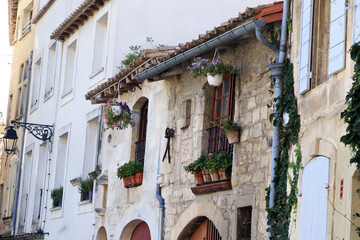windows in wall of medieval street in Arles France