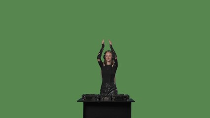 Female DJ mixing music in studio on green background