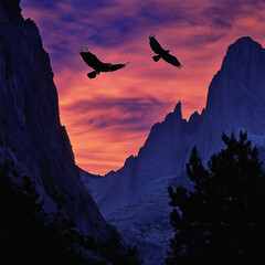 Fototapeta premium A dramatic sunset paints the sky with hues of fiery oranges and deep purples, casting long shadows over a rugged mountain range.