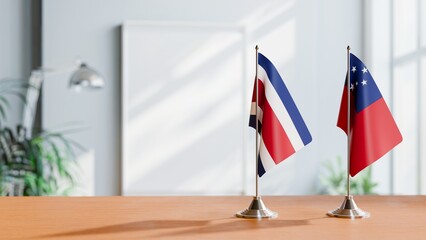 FLAGS OF COSTA RICA AND SAMOA ON TABLE
