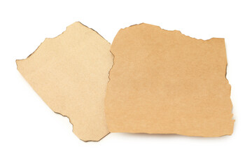 Pieces of old paper with dark burnt borders isolated on white