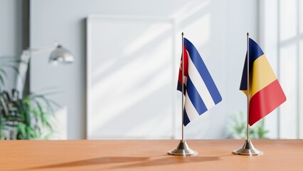 FLAGS OF CUBA AND ROMANIA ON TABLE