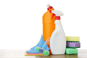 Different toilet cleaners, sponges and napkins on wooden table against white background