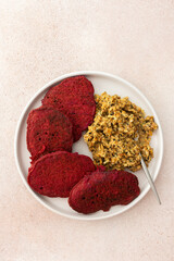 Beet pancakes with sunflower seed hummus - a healthy, vegetarian, and delicious dish combining nutritious and flavorful ingredients