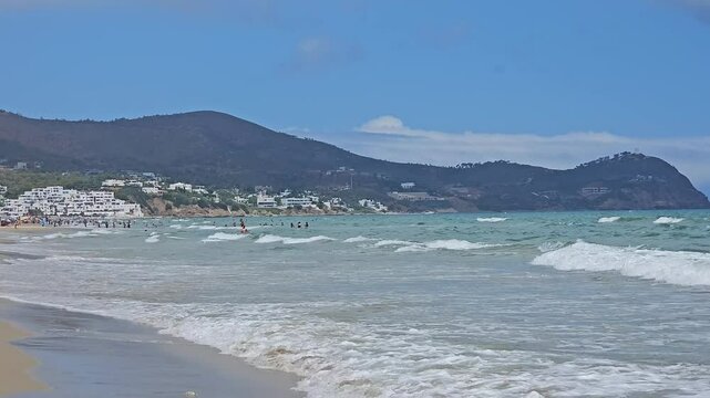 Tetouan, Morocco - 20 August 2024, view of people swimming and enjoying vacation in Cabo Negro, also known as Cabo Negro Beach and Golf Resort is a beach resort in northern Morocco 