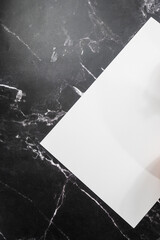white sheet on black marble