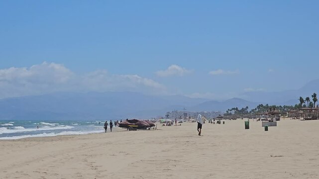 Tetouan, Morocco - 20 August 2024, view of people swimming and enjoying vacation in Martil beach  a town located on the Mediterranean Sea northeast of Tetouan